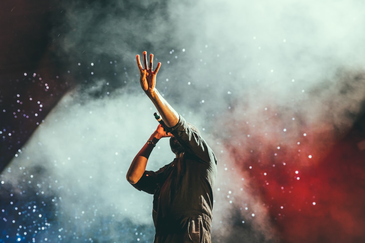 Concert stage lights and crowd energy — stand-in mood for a viral music drop